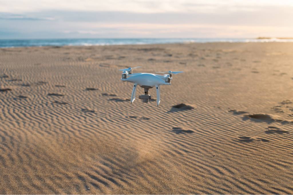 Drone flying over a desert landscape, demonstrating the creative possibilities of affordable used drones for aerial photography in 2025.