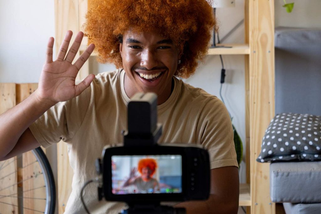 Young African American man streaming live using one of the best used cameras for TikTok