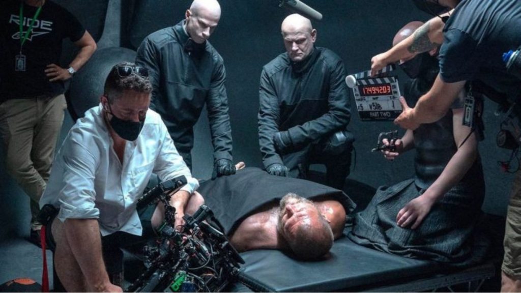 Behind-the-scenes image from Dune: Part Two showing a camera rig positioned close to a performer during an interior scene, illustrating practical on-set use of Dune: Part Two cinematography gear.