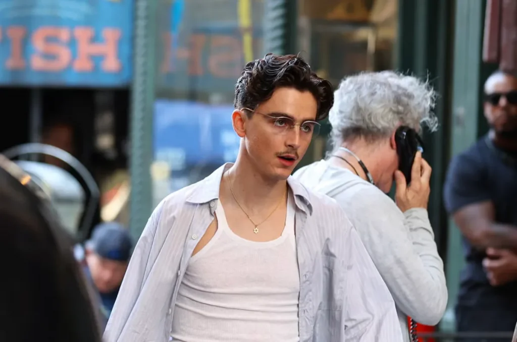 Marty Supreme film still showing cinematography that should win for its extreme contrast and street-level grit