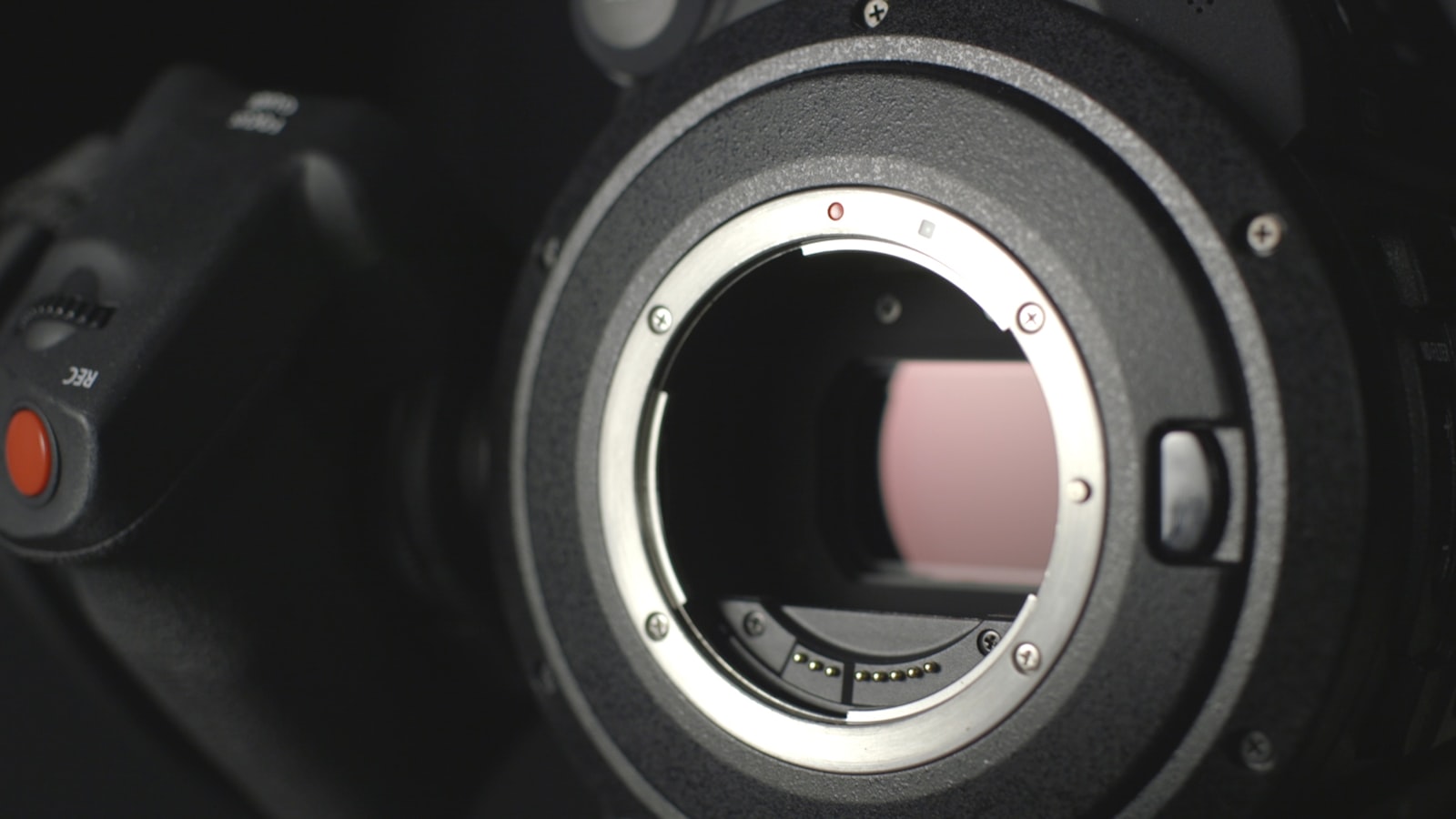 close-up of a DSLR camera body lens mount showing metal contacts and sensor